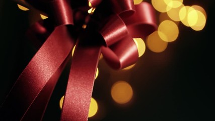 red ribbons and golden bokeh shining for anniversary , party and shopping background