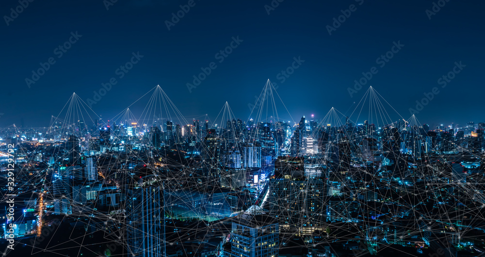 Modern city with wireless network connection and city scape concept.Wireless network and Connection technology concept with city background at night. - obrazy, fototapety, plakaty 