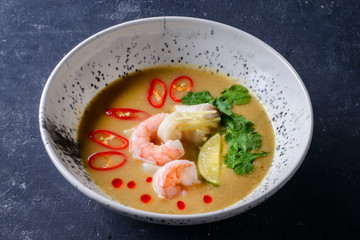 Sticker - thai traditional tom yam kung soup in a white bowl