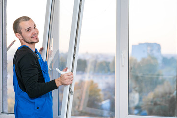 Professional master at repair and installation of windows, at work