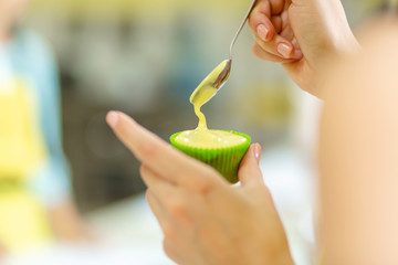 The process of making cupcakes. Creation of cakes by professional pastry chefs