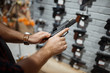 © Nomad_Soul - Man choosing new handgun in gun shop