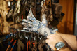 © Nomad_Soul - Man choosing gloves for hunters in gun shop