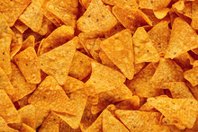 Heap Of Mexican Nachos Or Tortilla Chips As Texture Background