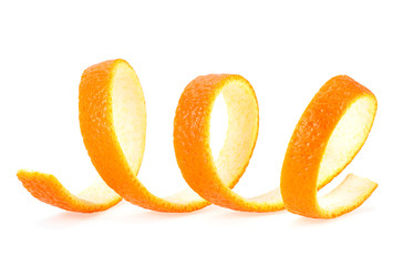 Close-up of spiral orange peel isolated on a white background. Citrus fruit.