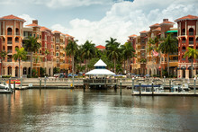 Waterfront Pier And Boat Dock By The Shopping District Of Naples, Florida, USA