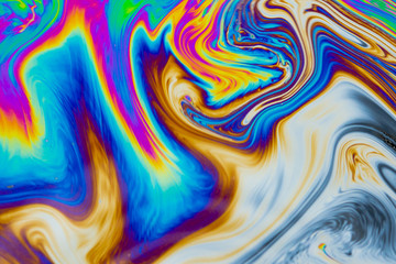 Wall Mural - psychedelic abstract background. photo macro shot with light interference on the surface of a soap b