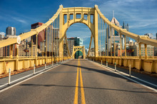 Traffic And People Cross The Allegheny River On The Roberto Clemente Bridge In Downtown Pittsburgh Pennsylvania USA