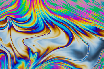 Wall Mural - psychedelic abstract background. photo macro shot with light interference on the surface of a soap b