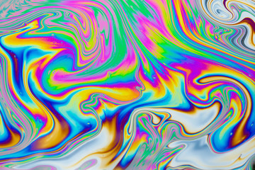 Wall Mural - psychedelic abstract background. photo macro shot with light interference on the surface of a soap b
