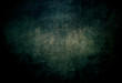 Modern abstract background dark mysterious with turquoise middle in dirty grunge style with scratches