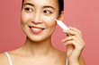 © Beauty Agent Studio - Young woman applying eye lifting cream. Asian beauty model concept.
