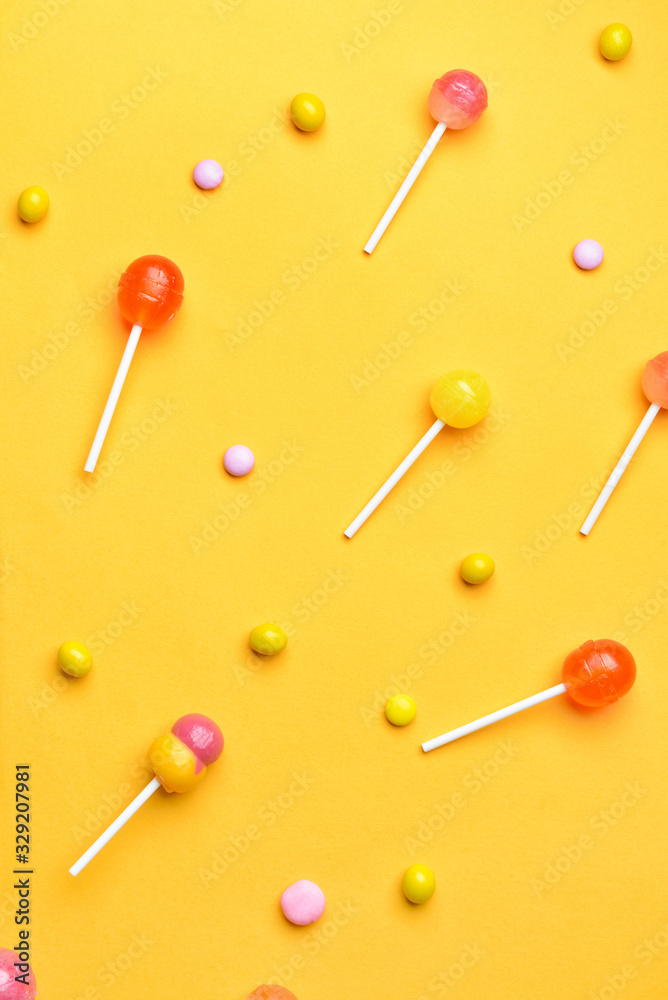 Tasty candies on color background