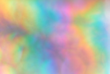 Color Neon Gradient. Abstract Blurred Background. Silver Paper With A Holographic Effect. Close Up Shot