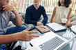 © DragonImages - Cropped image of business people arguing at meeting in cafe when watching presentation on laptop