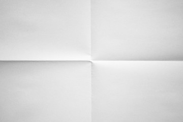 Wall Mural - White paper folded in four fraction background