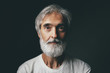 © luengo_ua - Studio portrait of handsome senior man with gray beard.