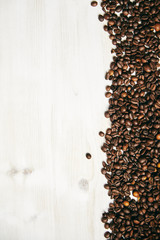  Wood background with coffee beans on the sides