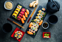 Apanese Sushi Food. Maki Ands Rolls With Tuna, Salmon, Shrimp, Crab And Avocado. Top View Of Assorted Sushi. Rainbow Sushi Roll, Uramaki, Hosomaki And Nigiri