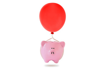 Piggy bank with red balloon floating on white background - Concept of economy and savings