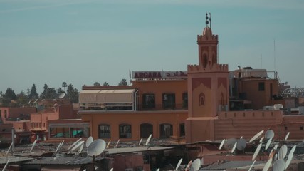 Wall Mural - view of a mosque in Jamaa El Fna square