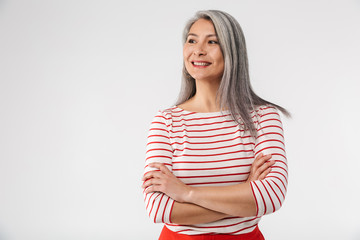 Wall Mural - Image of adult mature woman with long gray hair smiling at camera