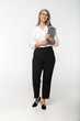 © Drobot Dean - Image of adult mature woman wearing office clothes holding clipboard