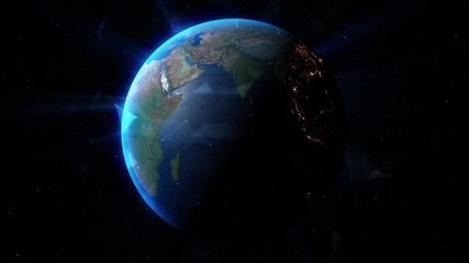 Wall Mural - the sun's rays behind the earth create a glow of the atmosphere earth in outer space. elements of th