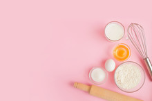 Frame Of Food Ingredients For Baking On A Gently Pink Pastel Background. Cooking Flat Lay With Copy Space. Top View. Baking Concept.