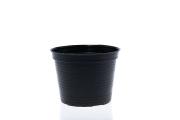 Blank black plastic plant pots isolated on white background.