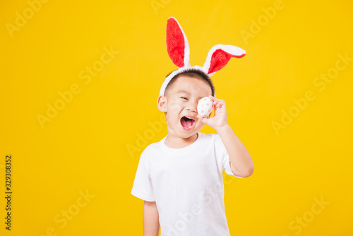 Fotografía little children boy smile standing so happy bunny ears in Easter festival day ho