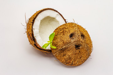 Ripe coconut cut on two half isolated on white background