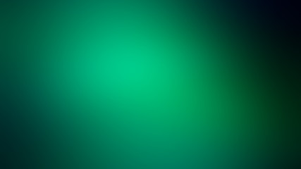 abstract green blurred background with dark edges.