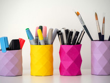 Handmade Colored Pencil And Pens Holders On A Table