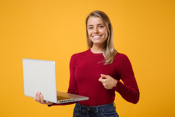 smiling beautiful young blonde woman girl in casual clothes posing isolated on yellow orange wall ba