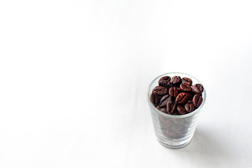 Coffee beans in cup On a white background