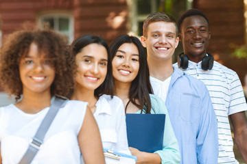 Closeup Portrait Of Interracial Students Standing Outdoors, Posing At Camera