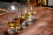 Tasting Of Flight Of Scotch Whisky From Special Tulip-shaped Glasses On Distillery In Scotland, UK