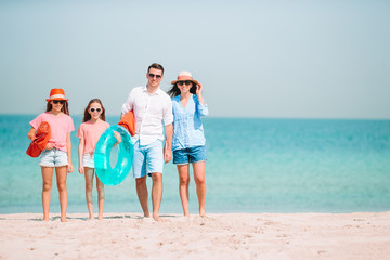 Happy beautiful family on a tropical beach vacation