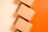 Fototapeta Lawenda - Set of brown cardboard boxes on colorful background