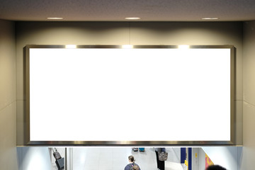 Wall Mural - Blank billboard mockup near to escalator in an mall, shopping center, airport terminal, office building or subway station.