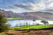 A view of Rydal Water on a clam day taken from the Coffin Route showing Loughrigg Fell in the distance near Grasmere. 