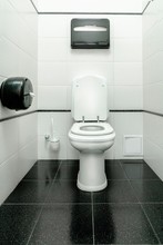 Toilet, Toilet Room In The Style Of Minimalism. White Walls And Black Floor. Graphics And Contrast