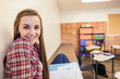 © MACO - Portrait of school girl alone in school classroom . Red Lodge, Montana, USA