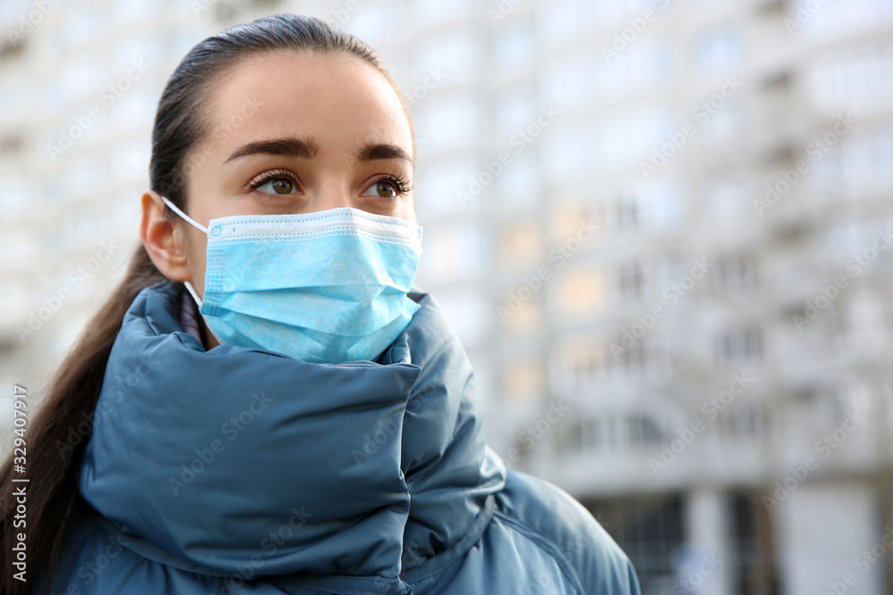 Woman wearing disposable mask outdoors. Dangerous virus - obrazy, fototapety, plakaty 