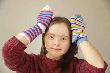 Wall Mural - Beautiful girl smiling with different socks