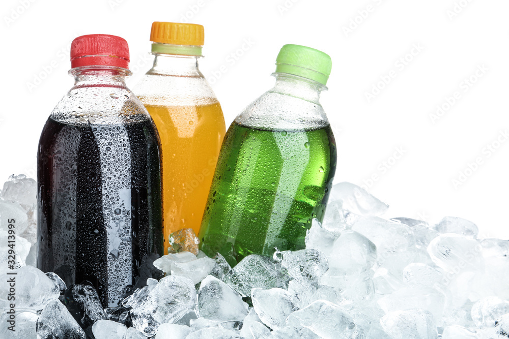 Ice cubes and different soda drinks on white background - obrazy, fototapety, plakaty 