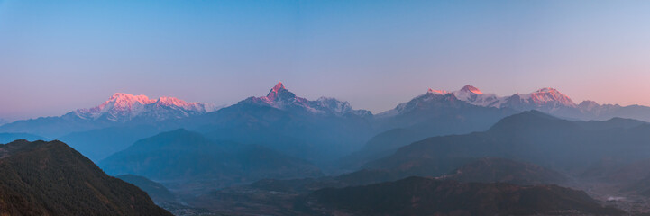 Sunrise panoramic view from Sarangkot Hill with Himalayan Mountains in background such as Annapurna, Hiunchuli, Kangshar Kang (Roc Noir), Mardi Himal, Machapuchare and Lamjung Himal, Pokhara, Nepal