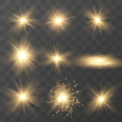 Wall Mural - set of golden glowing light . sparkling magical dust particles. star burst with sparkles on a transp