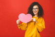 © denis_vermenko - Photo of amazing young woman holding big pink paper heart thinking over right answer on date invitation wears casual isolated red color background.